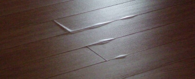 vinyl-floor-tiles-lifting-due-to-heat-damage
